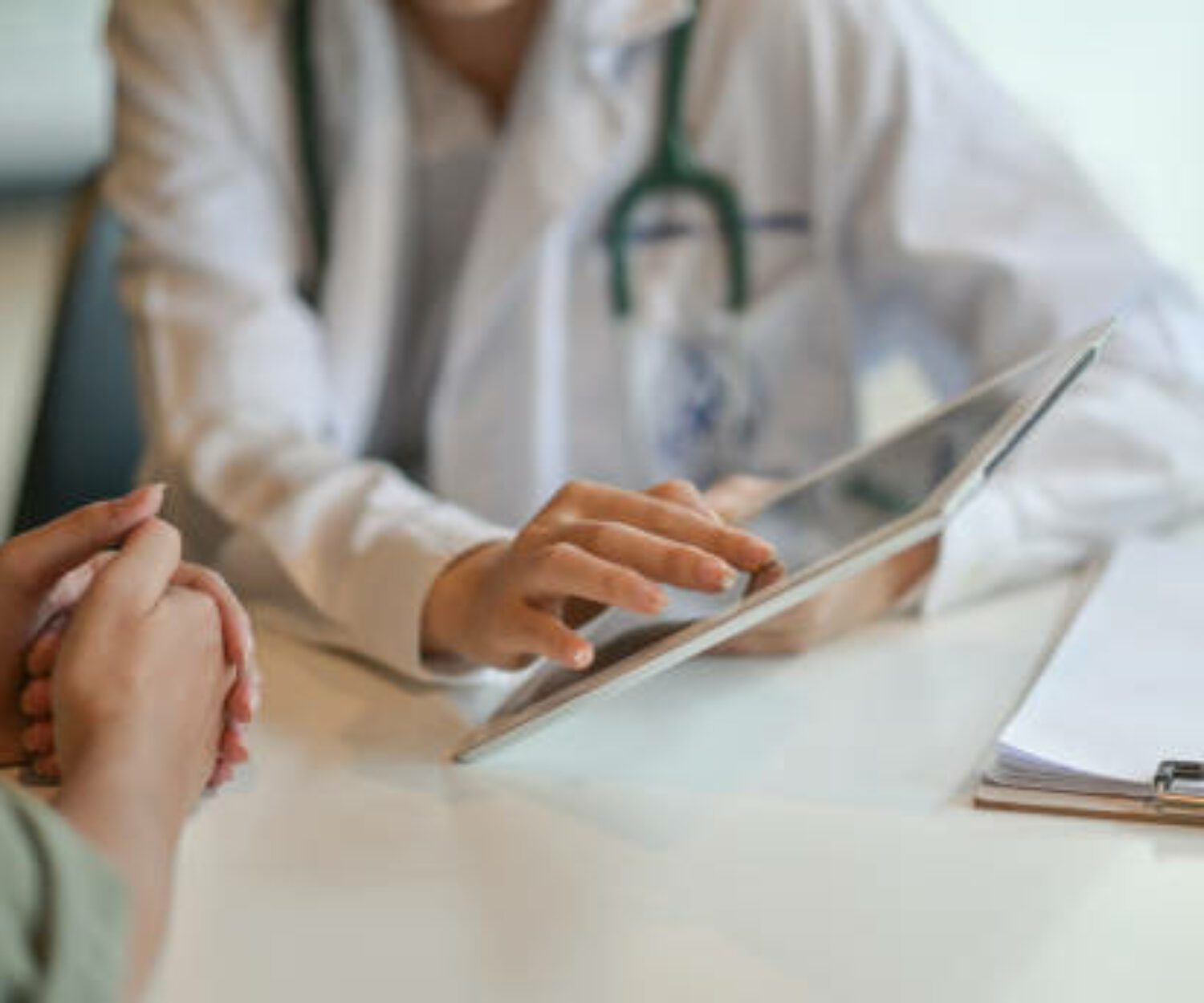Shot of a doctor showing a patient some information on a digital tablet